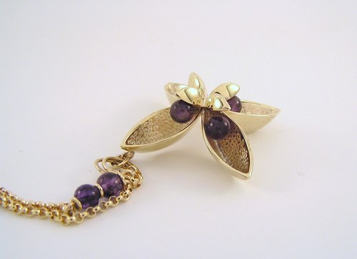 Four-pod gold and amethyst pendant