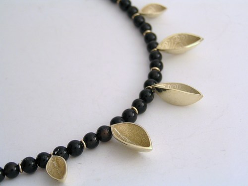 Gold and onyx multiple half-pod necklace